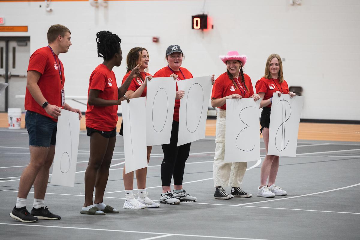 Doane students holding up signs that read $30,016, the number of dollars raised at a recent Relay for Life event.